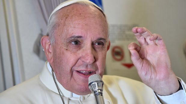 Pope Francis gestures as he talks with journalists during his flight from Manila to Rome, Monday, Jan. 19, 2015. Pope Francis flew home Monday after a weeklong trip to Asia, where he called for unity in Sri Lanka after a civil war and asked Filipinos to be "missionaries of the faith" in the world's most populous continent after a record crowd joined his final Mass in the Philippine capital. (AP Photo/Giuseppe Cacace, pool)